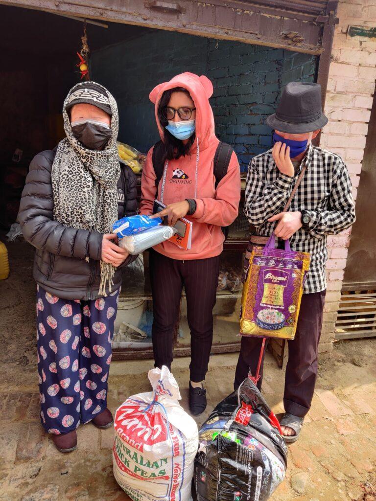 Handling over the food and hygiene kit.