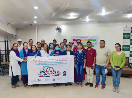 Group photo of Prayatna Nepal team & Nagarjun health workers holding the banner