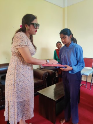 Ms Sarita lamichhane with a viusally impaired student